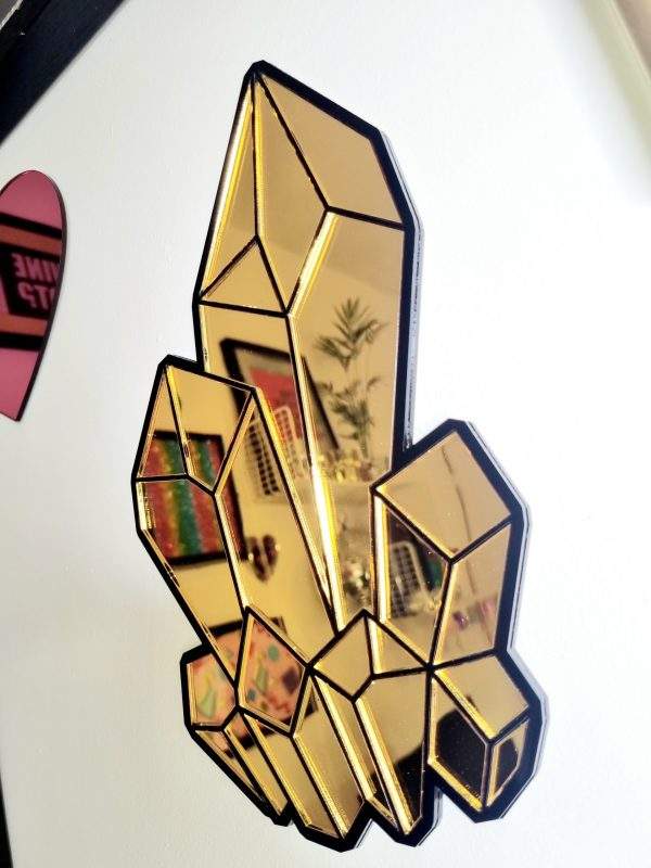 Gold and black crystal mirror wall art.