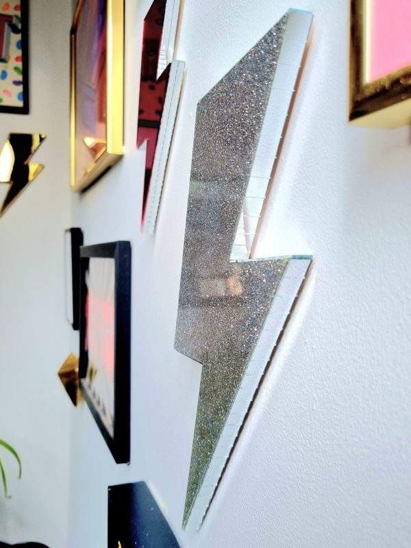 Silver glitter acry;ic lightning bolt wall art.