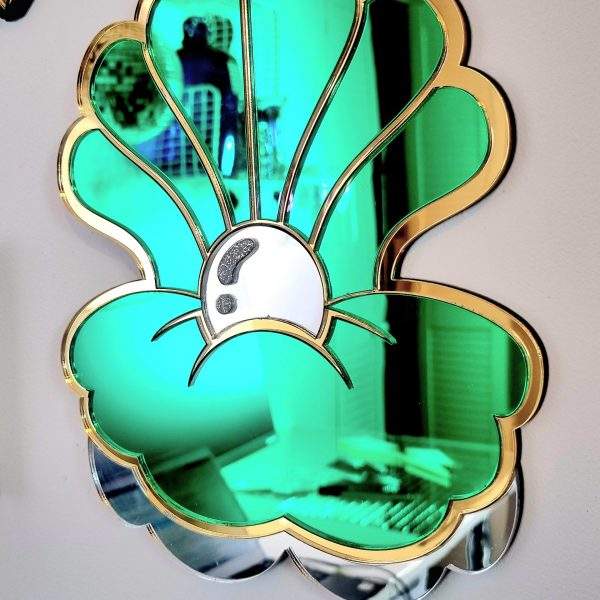Green and gold clam shell acrylic mirror wall art.