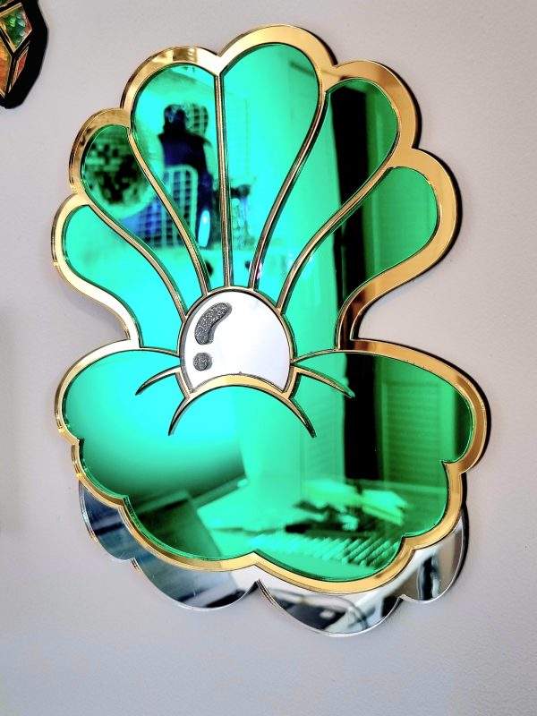 Green and gold clam shell acrylic mirror wall art.