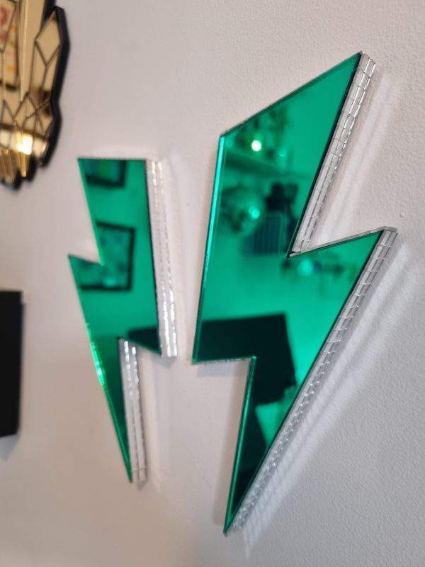 Green mirror acrylic lightning bolt with silver disco edging.
