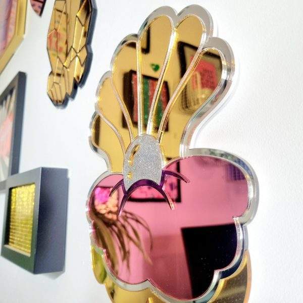 Pink, silver and gold claim shell mirror wall art.