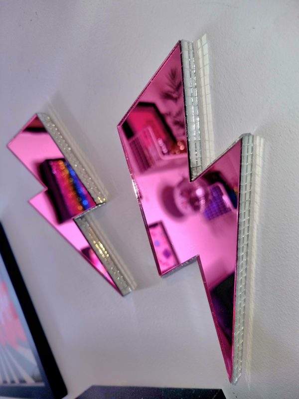 Pink mirror acrylic lightning bolt with silver disco edging.