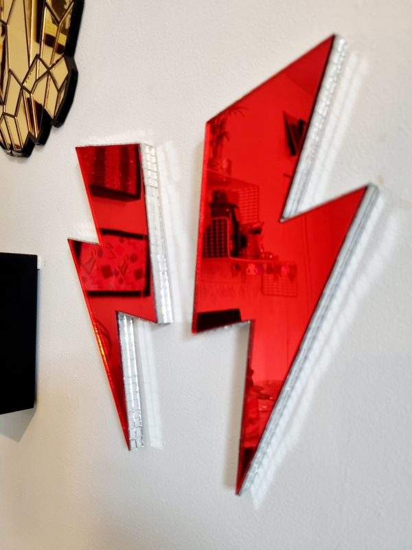 Red mirror acrylic lightning bolt with silver disco edging.