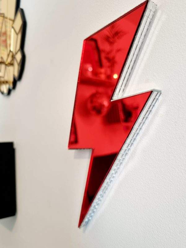 Red mirror acrylic lightning bolt with silver disco edging.