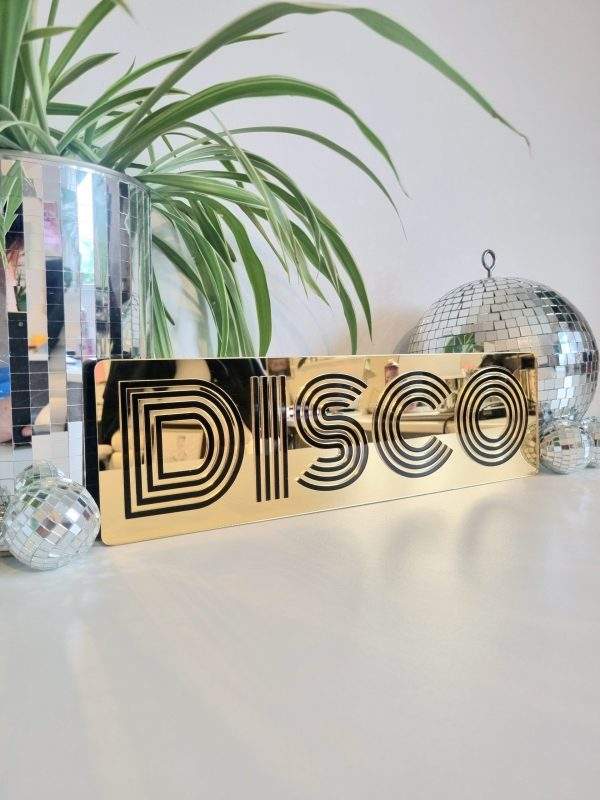 Gold and black disco mirror word art sign.