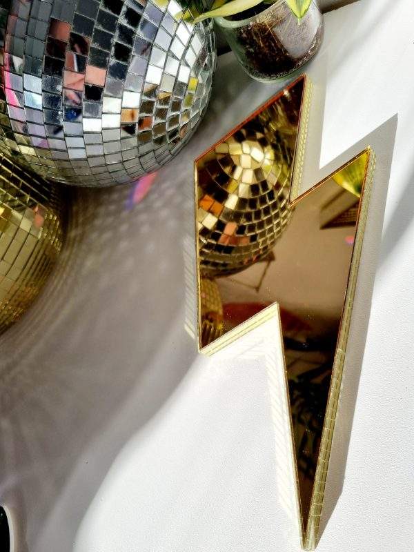 Gold mirrored lightning bolt with gold glass disco edging.