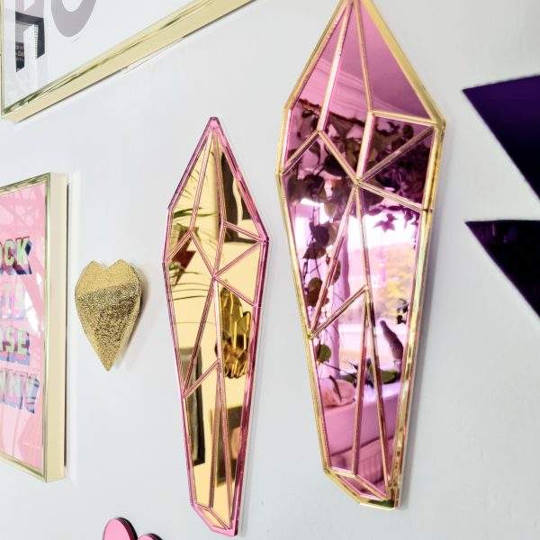 Crystal shaped mirror made with mirrored pink and gold acrylic.
