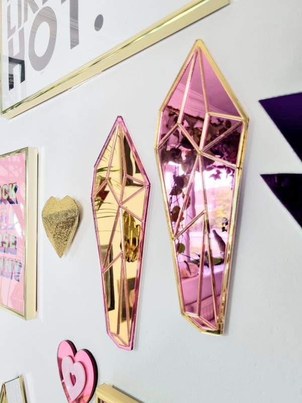 Crystal shaped mirror made with mirrored pink and gold acrylic.