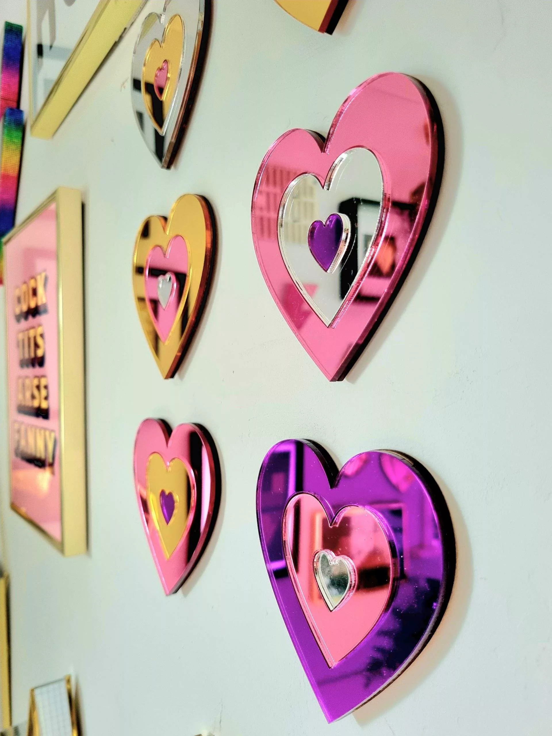A set of 6 hearts made from gold, silver, pink and purple mirrored acrylic.