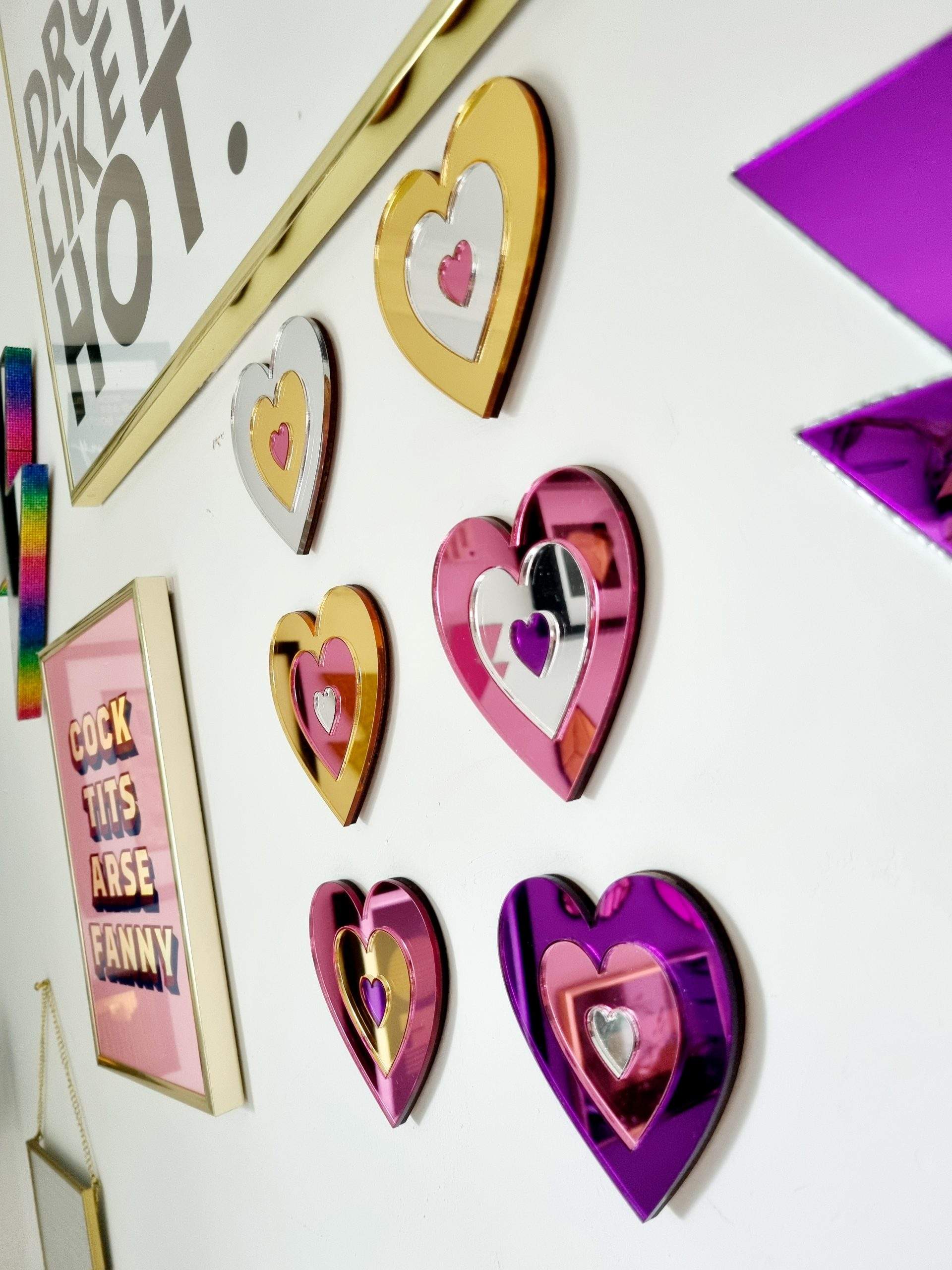 A set of 6 hearts made from gold, silver, pink and purple mirrored acrylic.