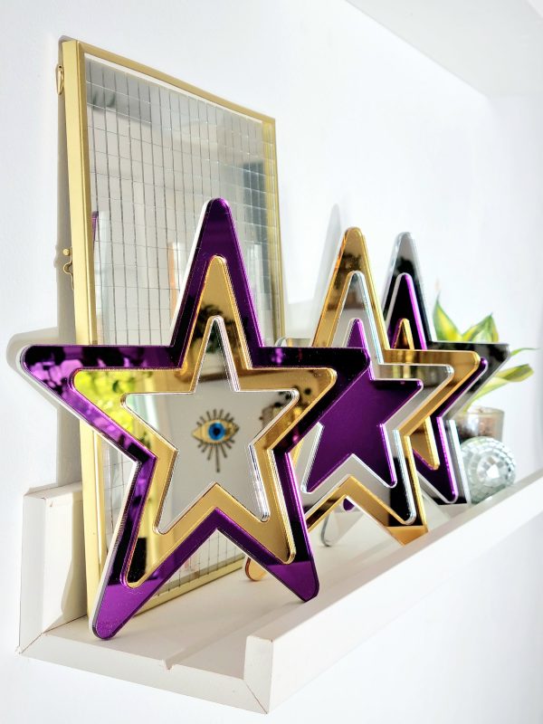 Set of mirror stars made from gold, purple and silver acrylic.