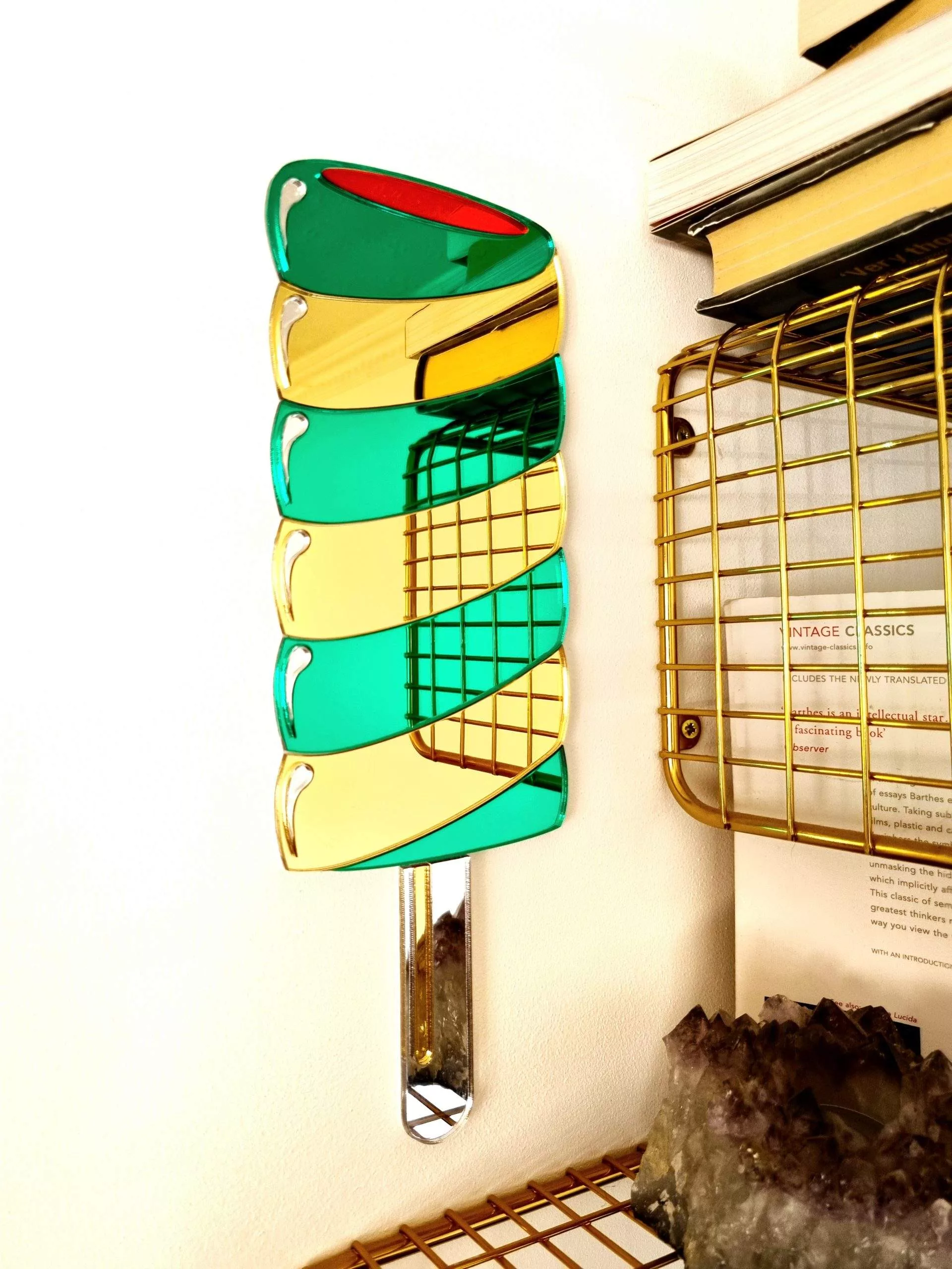 Hanamde Twister lolly mirror in gold and green.