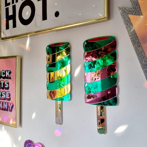 Hanamde Twister lolly mirror in gold and green.