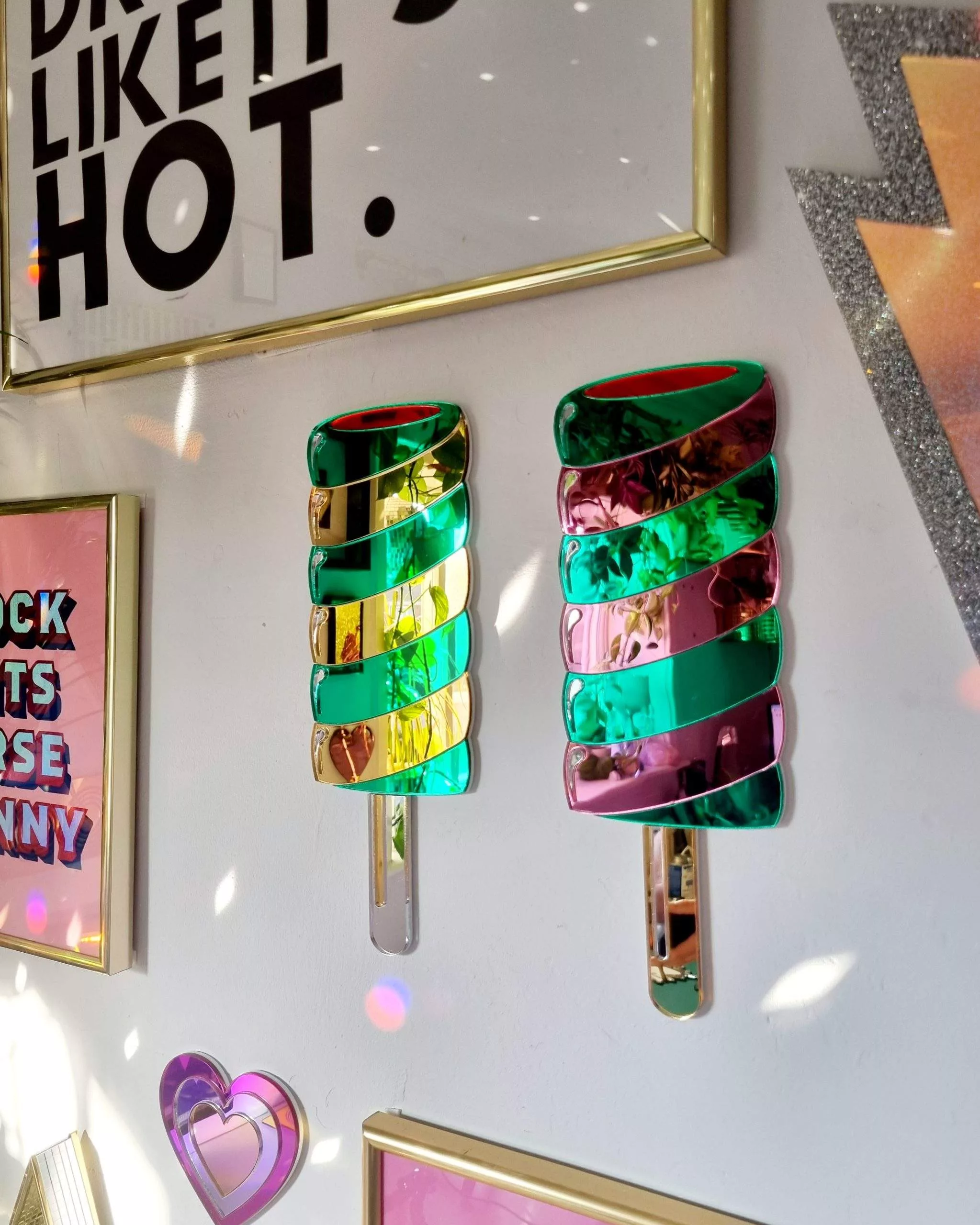 Hanamde Twister lolly mirror in gold and green.