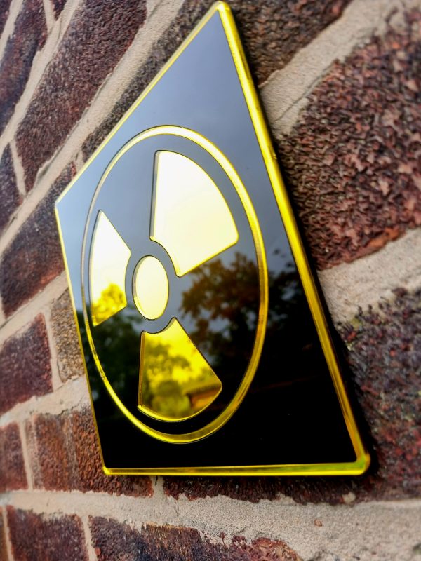 A mirror in the design of a radioactive symbol.