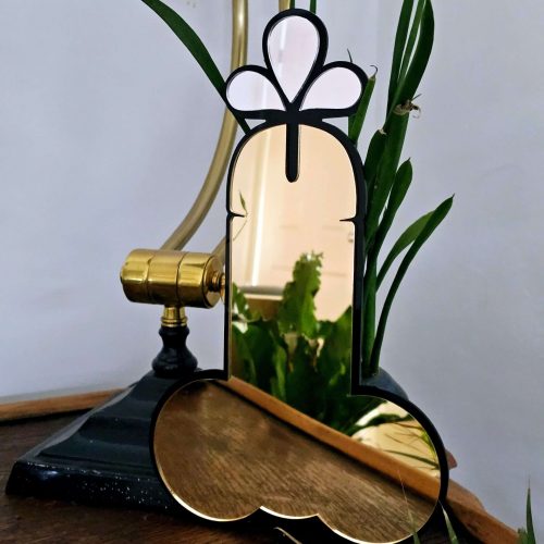A handmade mirror in the shape of a penis.