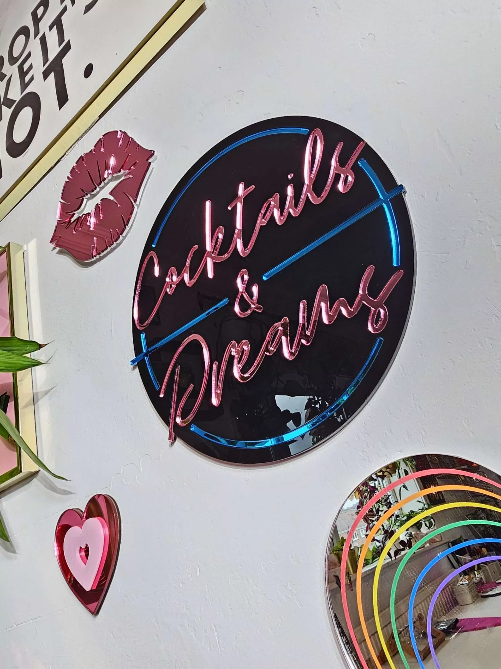 Cocktails and Dreams mirror wall art. A piece inspired by the film cocktail, made with black gloss acryilic and blue and pink mirrored lettering.
