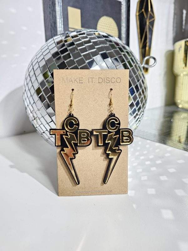Elvis Presley TCB earrings. Handmade earrings made in the style of the iconic Taking Care of Business necklace worn by The King himself. Made with black acrylic and mirror letters and lightning bolt.