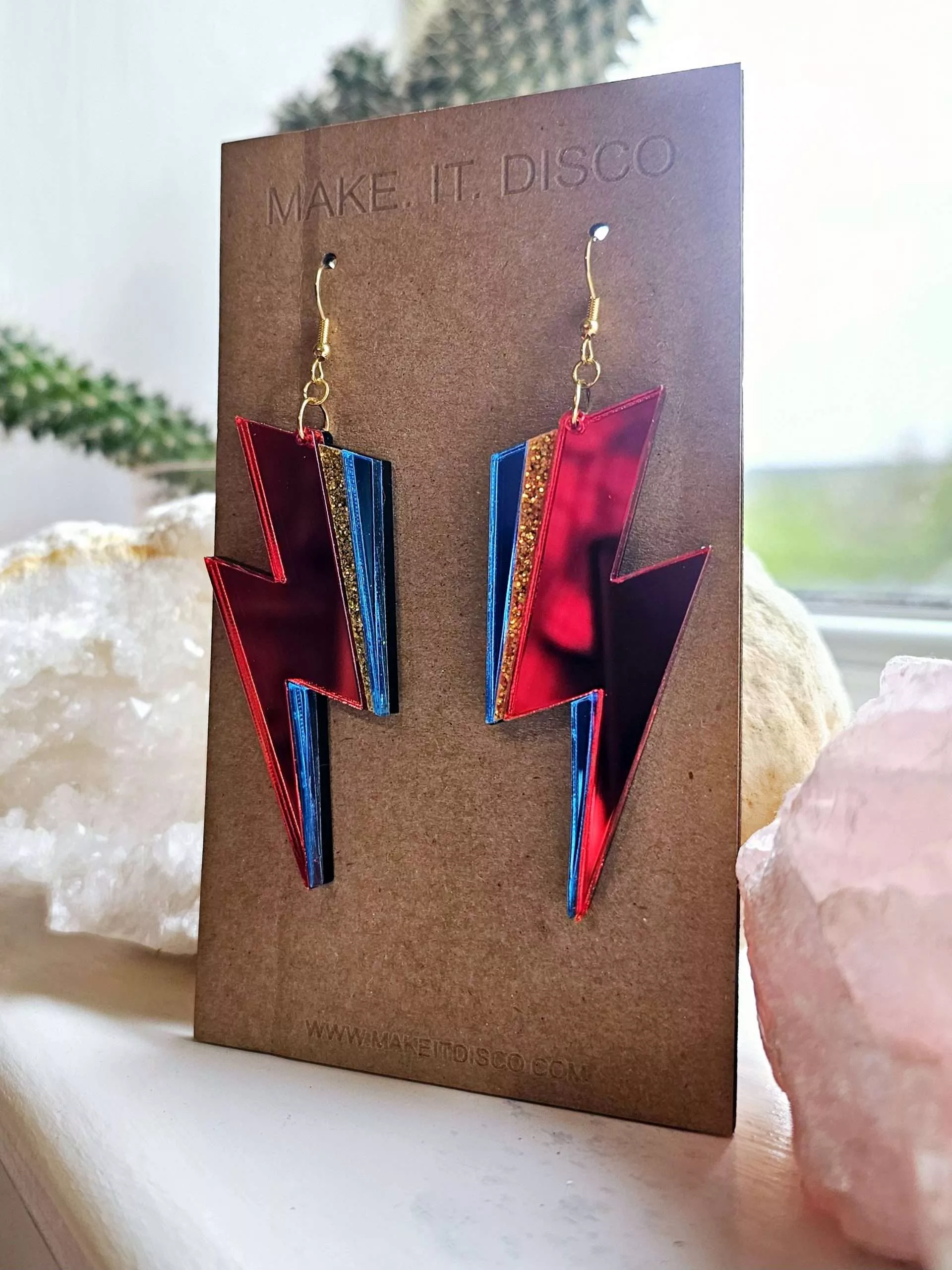 A pair of handmade earrings in the style of the lightning bolt David Bowie wore across his face.