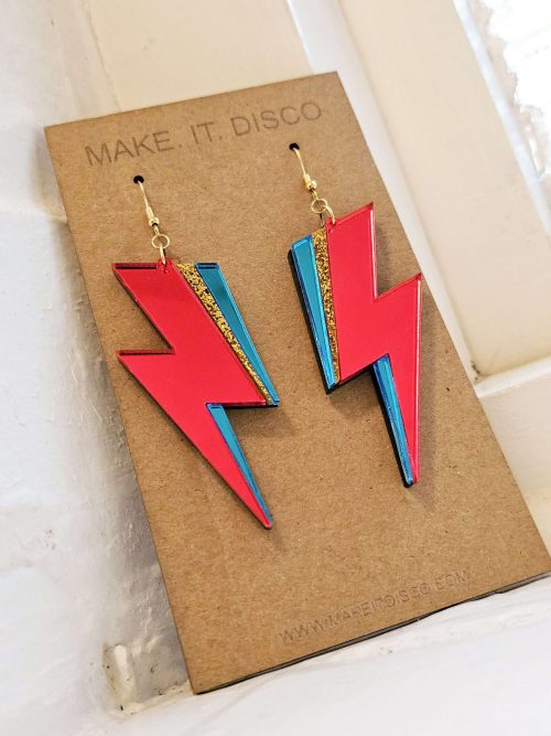 A pair of handmade earrings in the style of the lightning bolt David Bowie wore across his face.