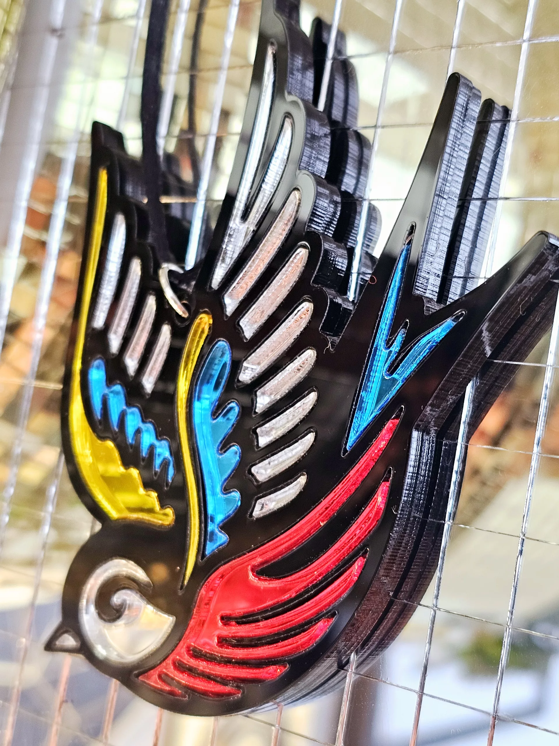 A Christmas tree ornament in the shape of a swallow. Made in a traditional tattoo style.