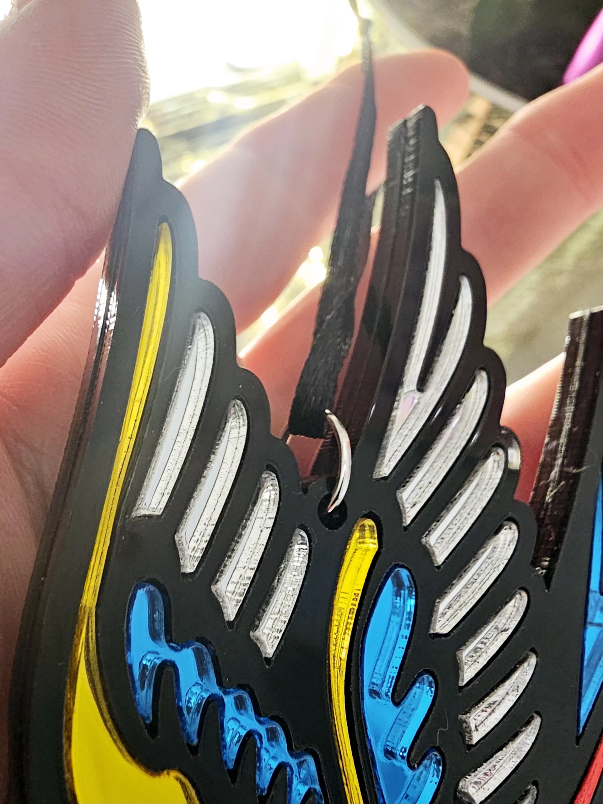 A Christmas tree ornament in the shape of a swallow. Made in a traditional tattoo style.
