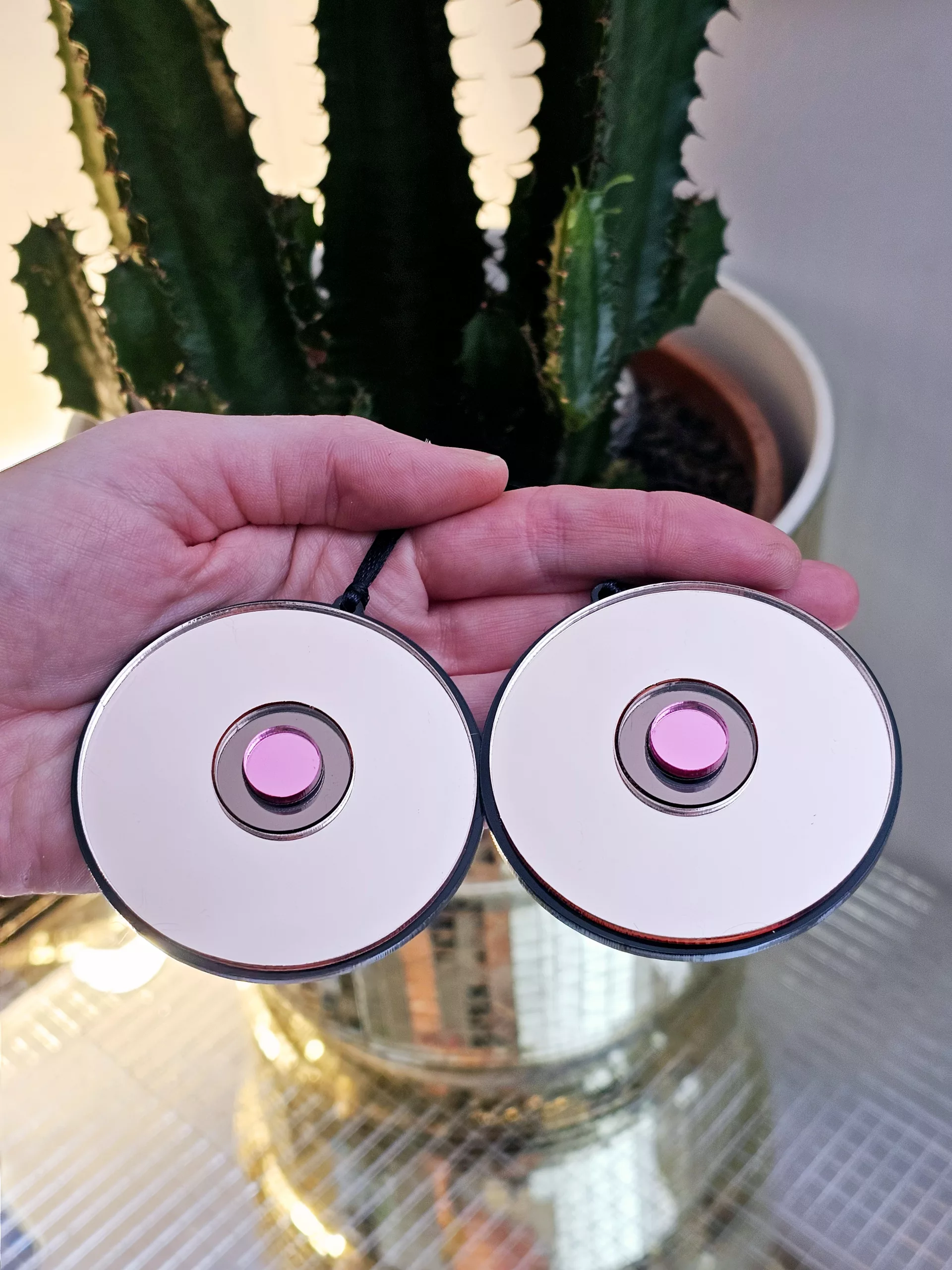 Christmas tree ornaments in the shape of a pair of boobs.