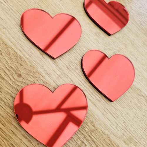 A set of 4 heart mirrors.