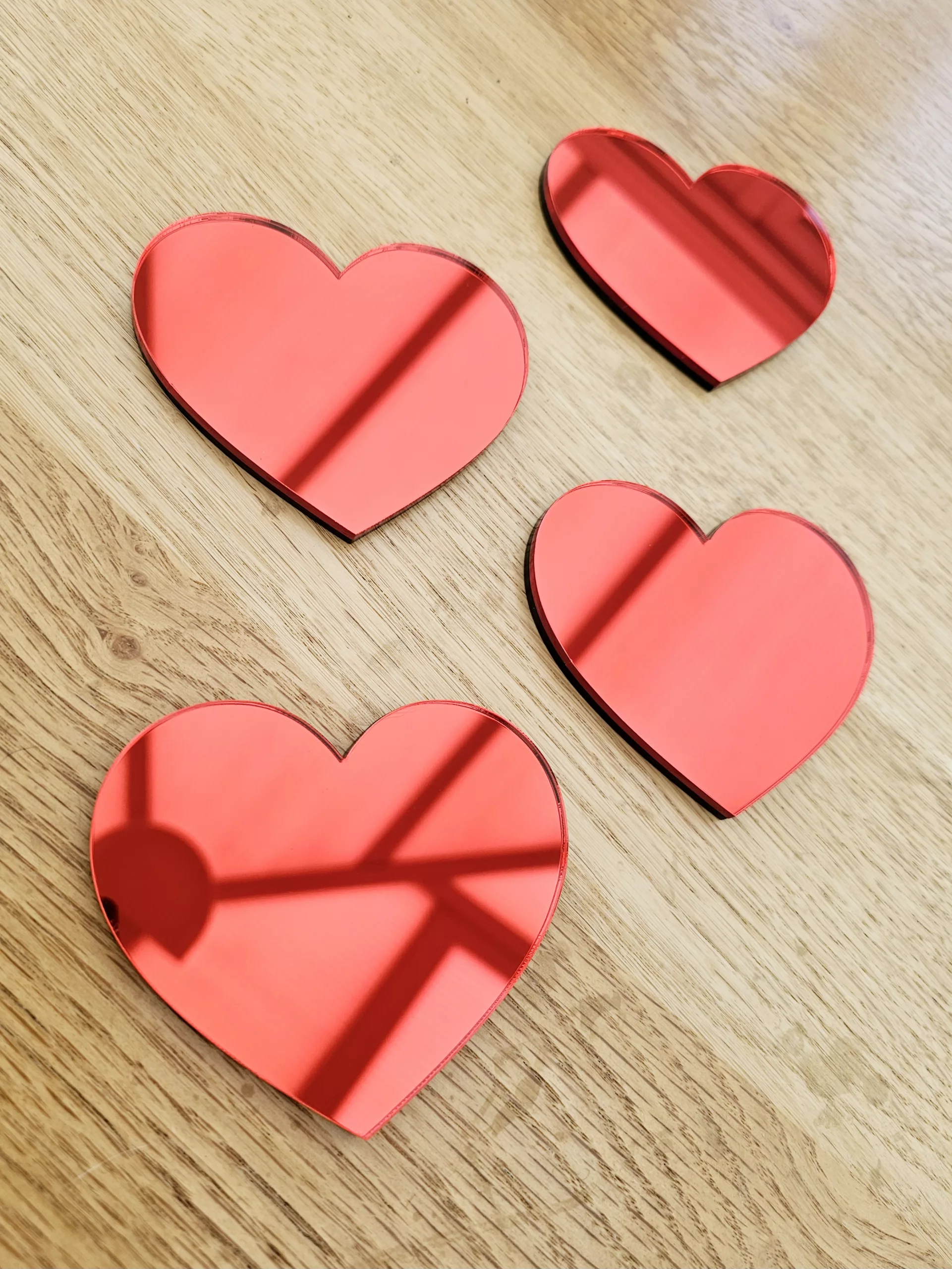 A set of 4 heart mirrors.
