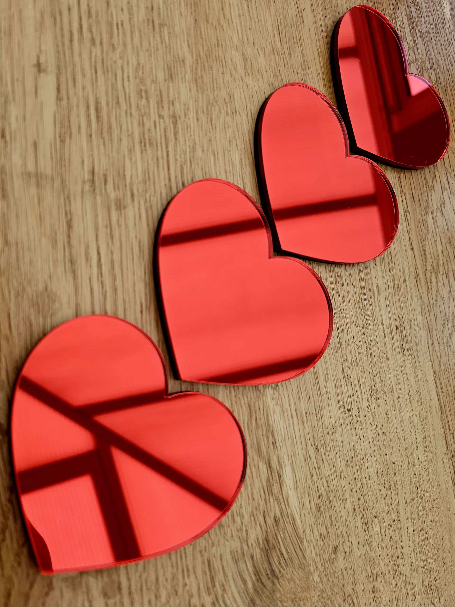 A set of 4 heart mirrors.