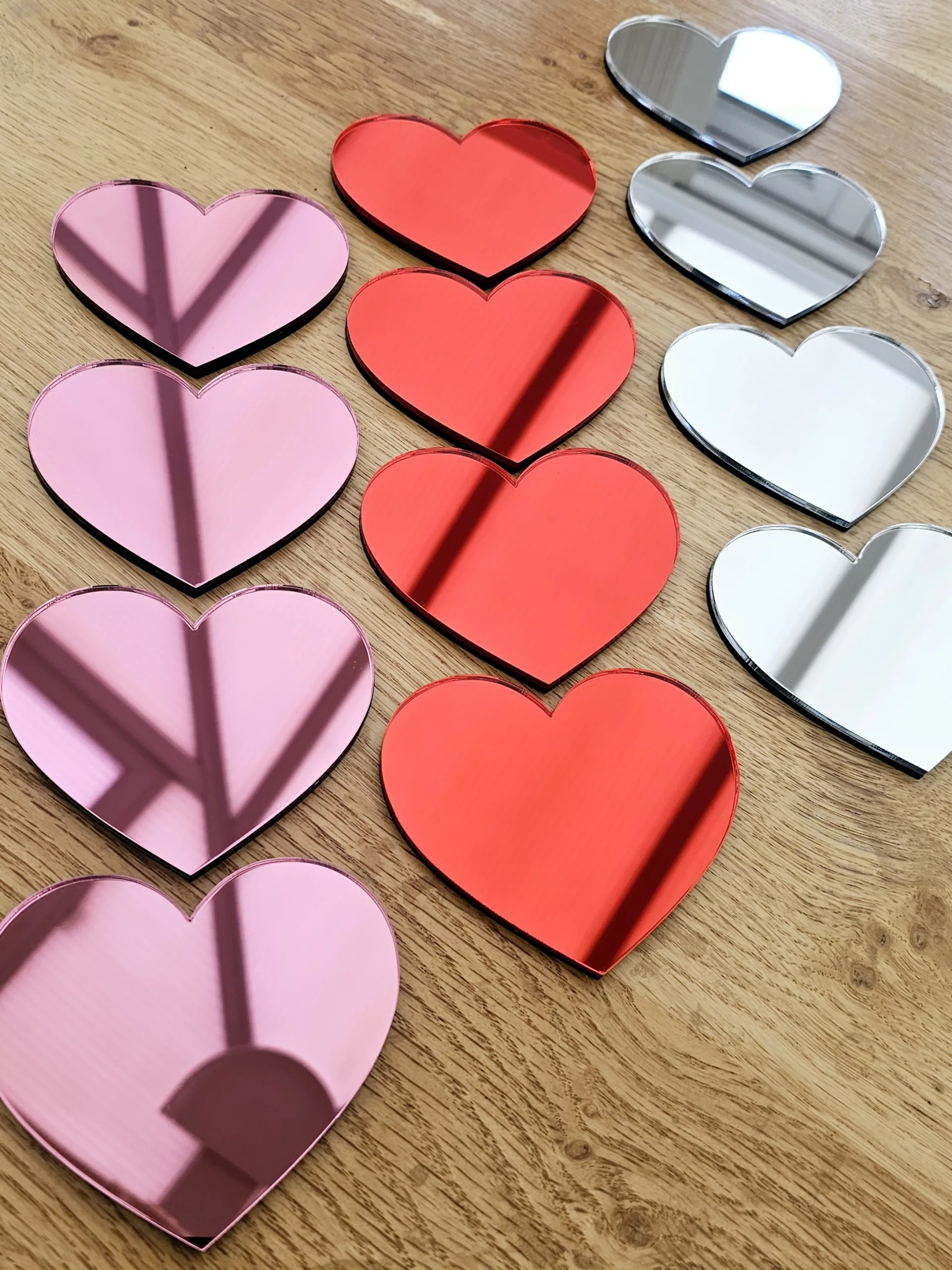 A set of 4 heart mirrors.
