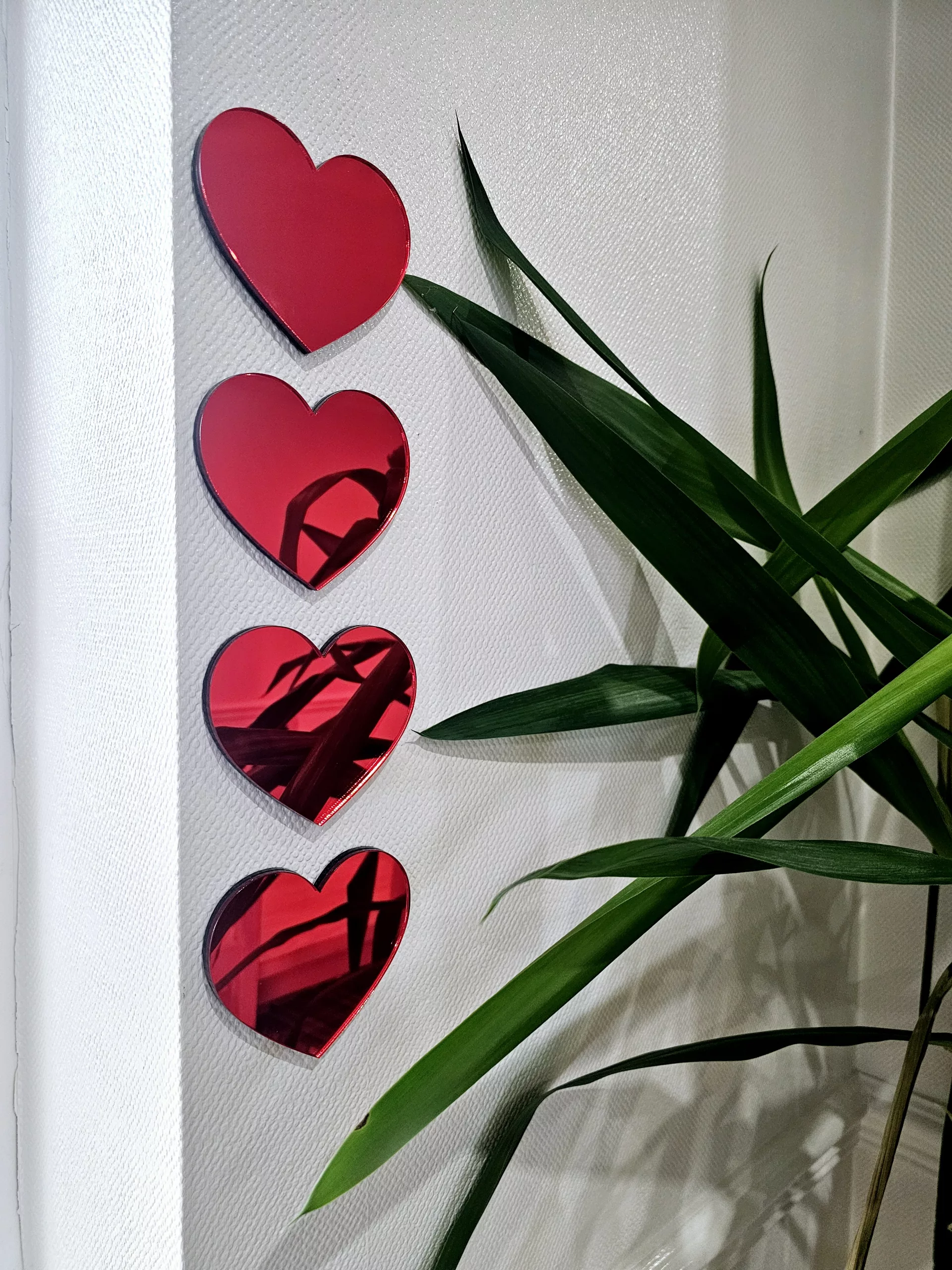 A set of 4 heart mirrors.