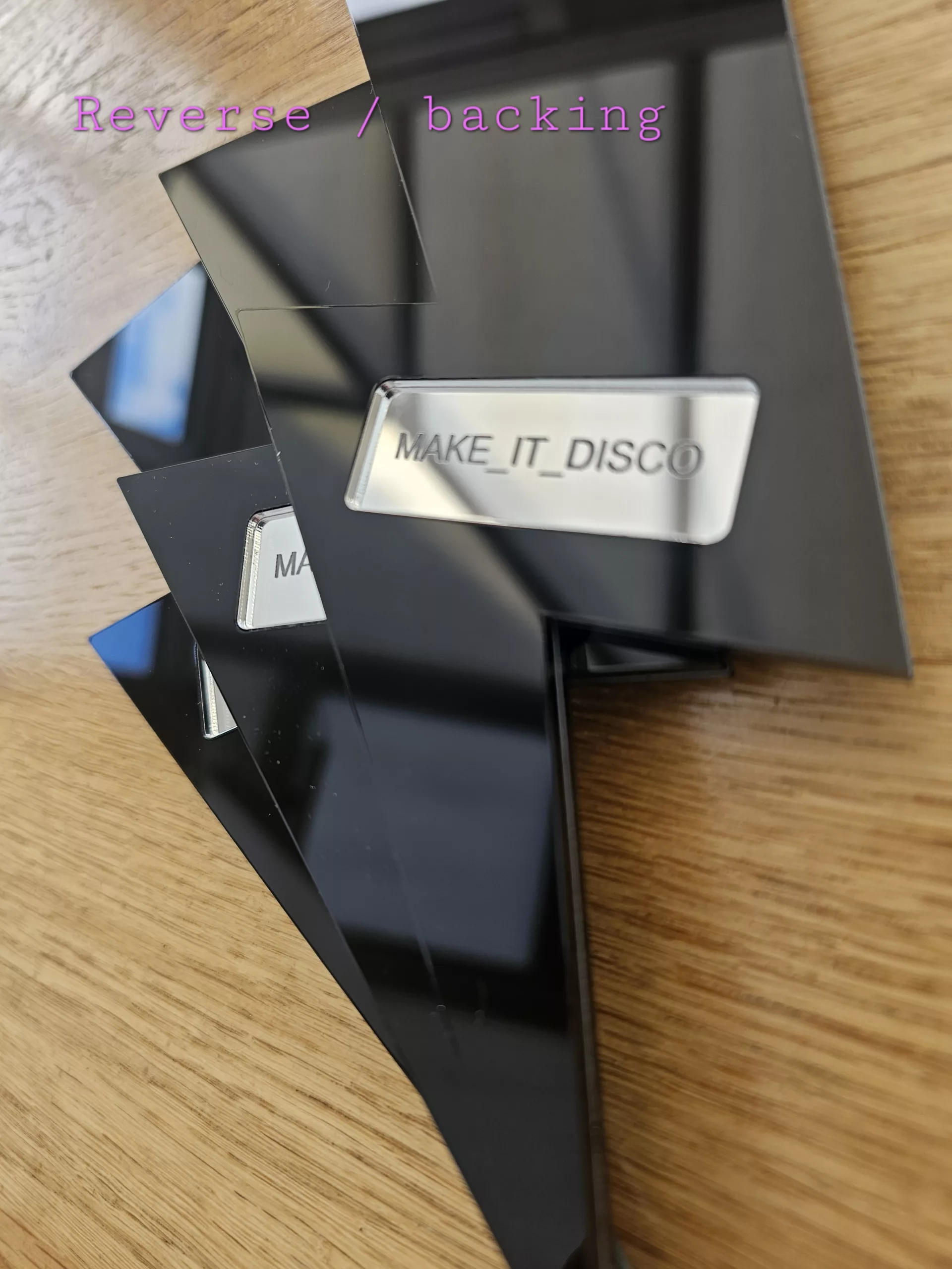 A set of 3 mirrors in the shape of a lightning bolt, in a variety of colours.