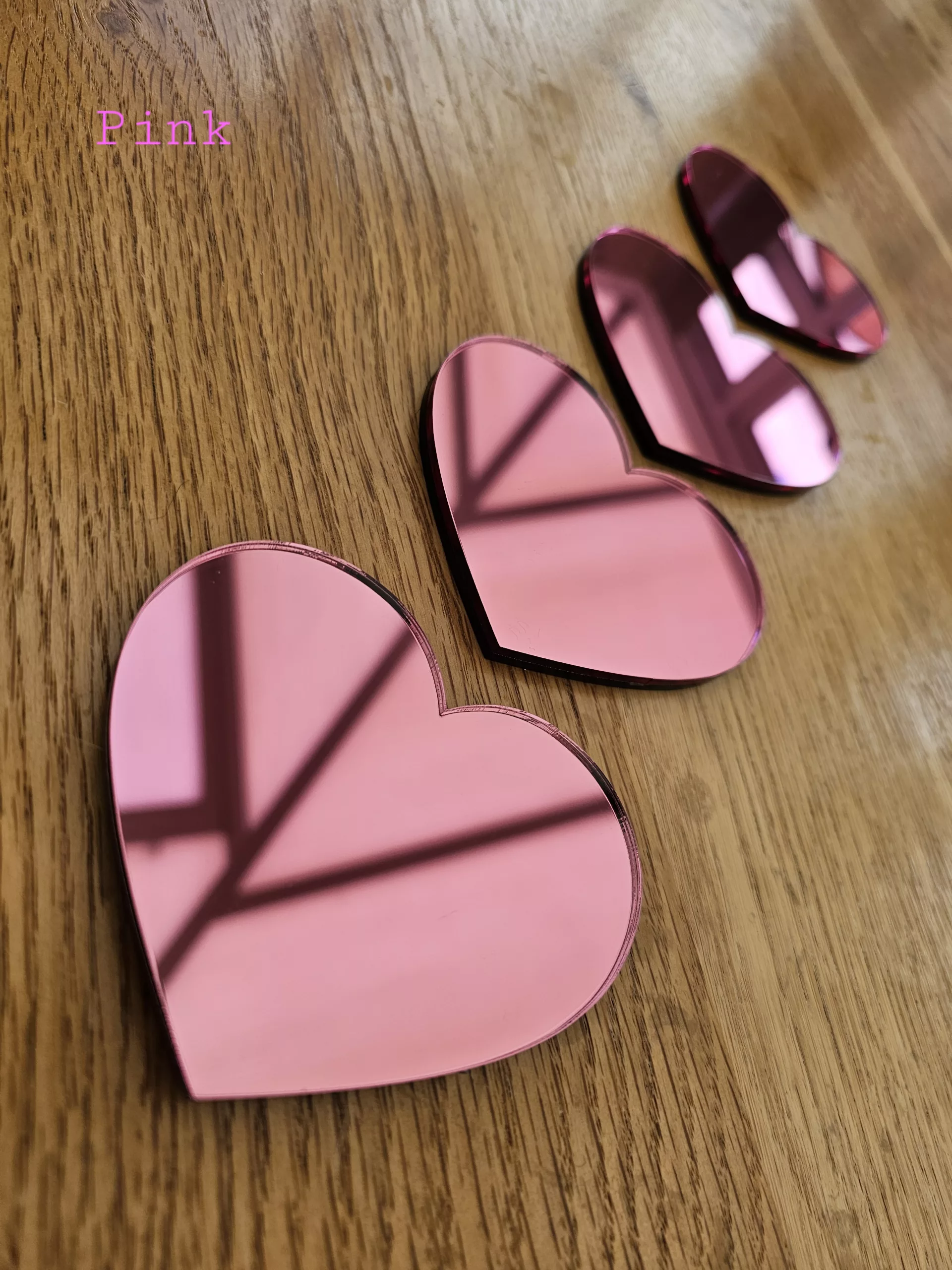 A set of 4 heart mirrors.