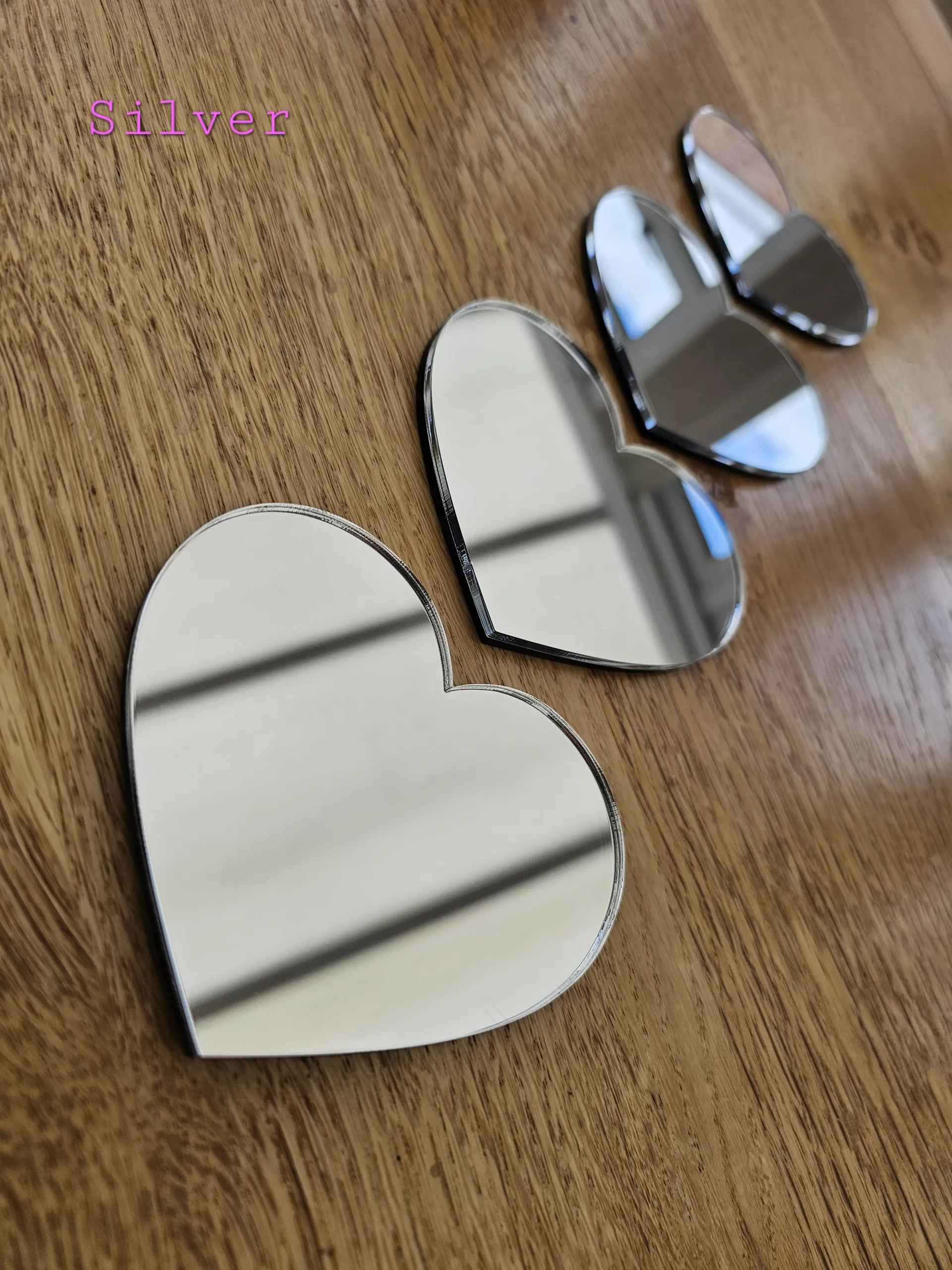 A set of 4 heart mirrors.