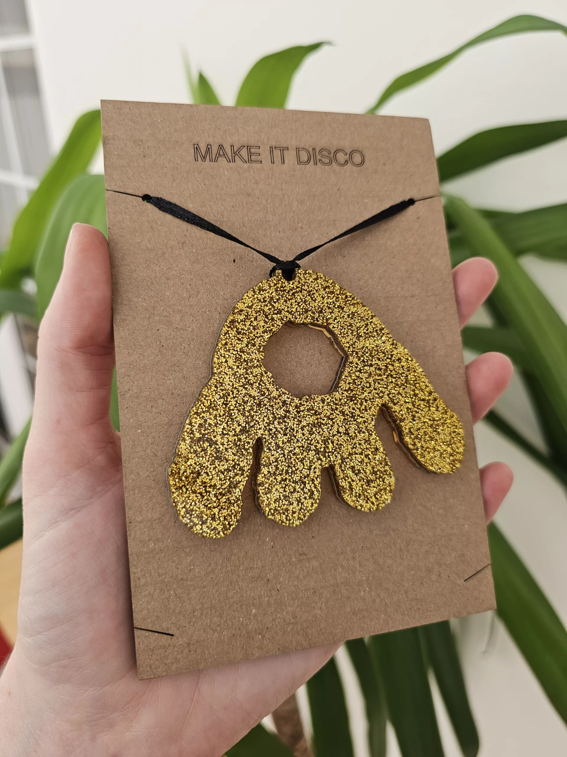 A Christmas tree decoration in the shape of a Monster Munch claw.