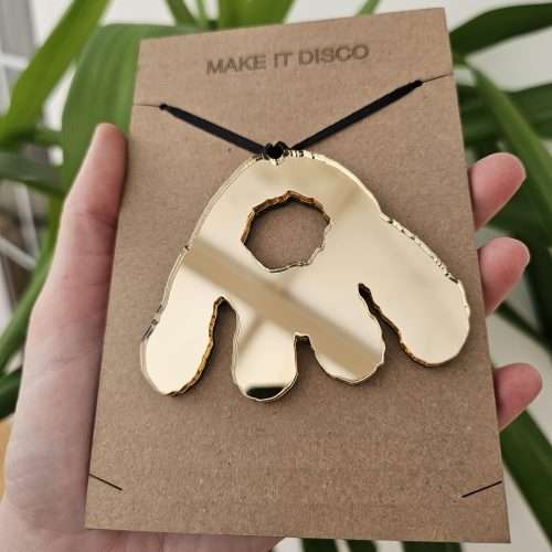 A Christmas tree decoration in the shape of a Monster Munch claw.