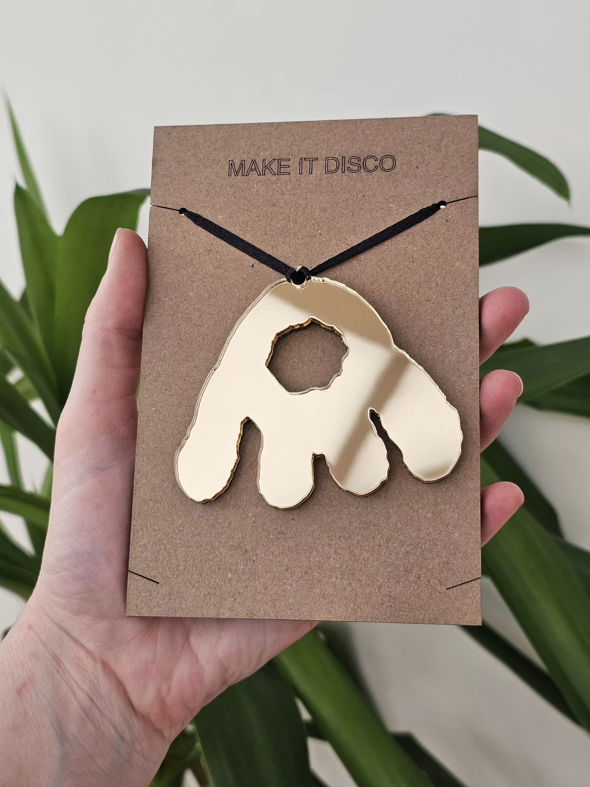 A Christmas tree decoration in the shape of a Monster Munch claw.