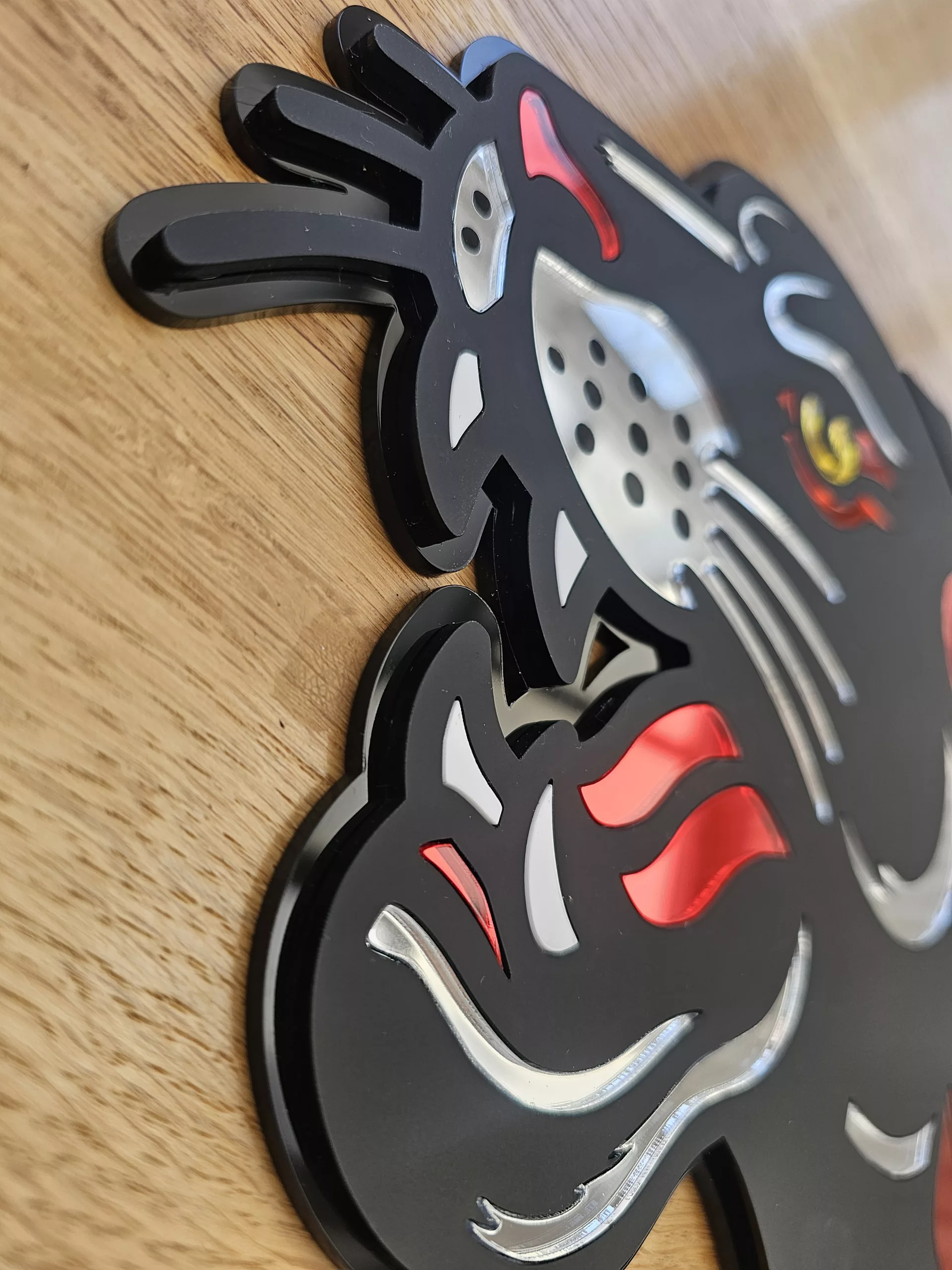 Handmade wall art in the style of an old school japanese panther tattoo. Made with matt black and mirror accents.