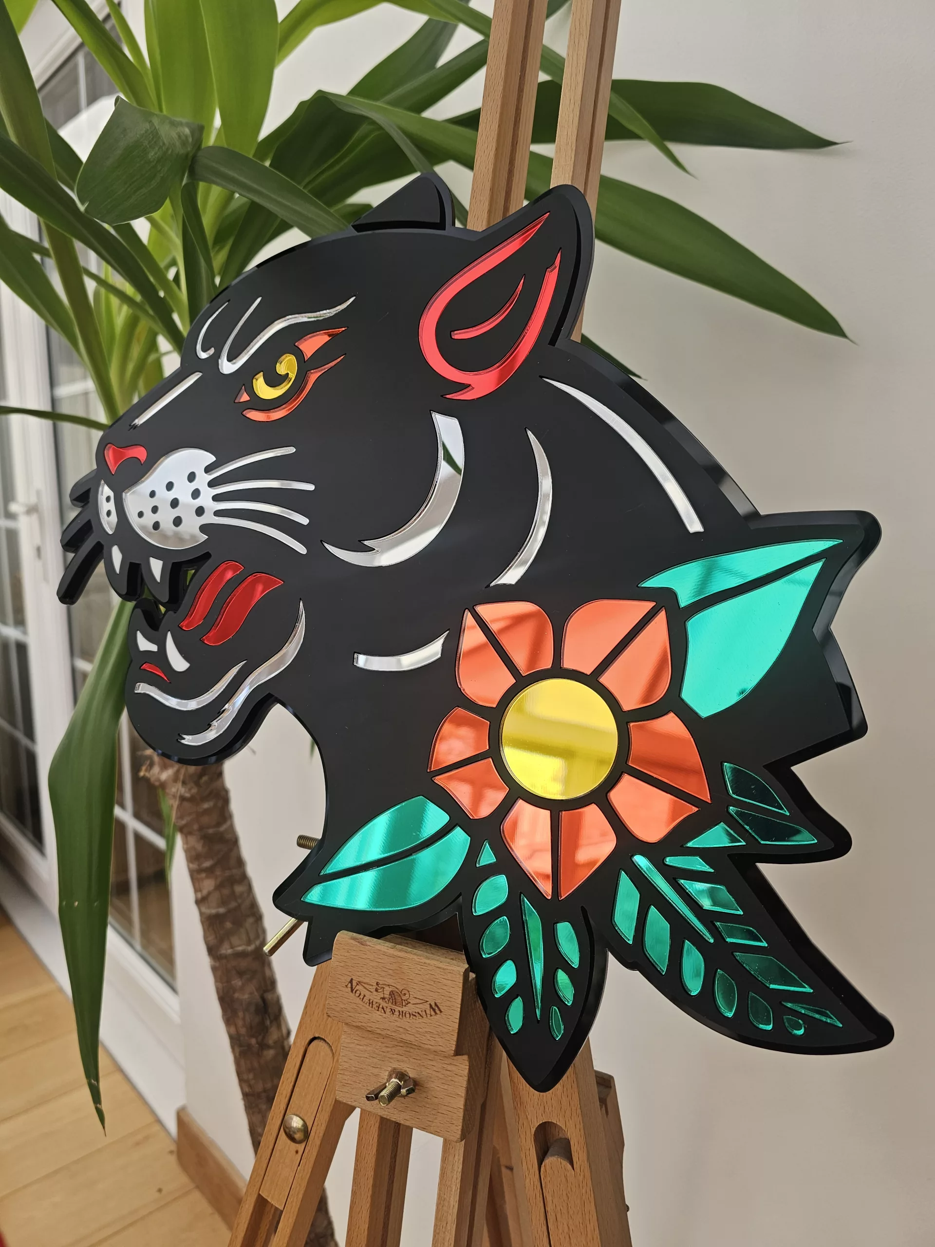 Handmade wall art in the style of an old school japanese panther tattoo. Made with matt black and mirror accents.