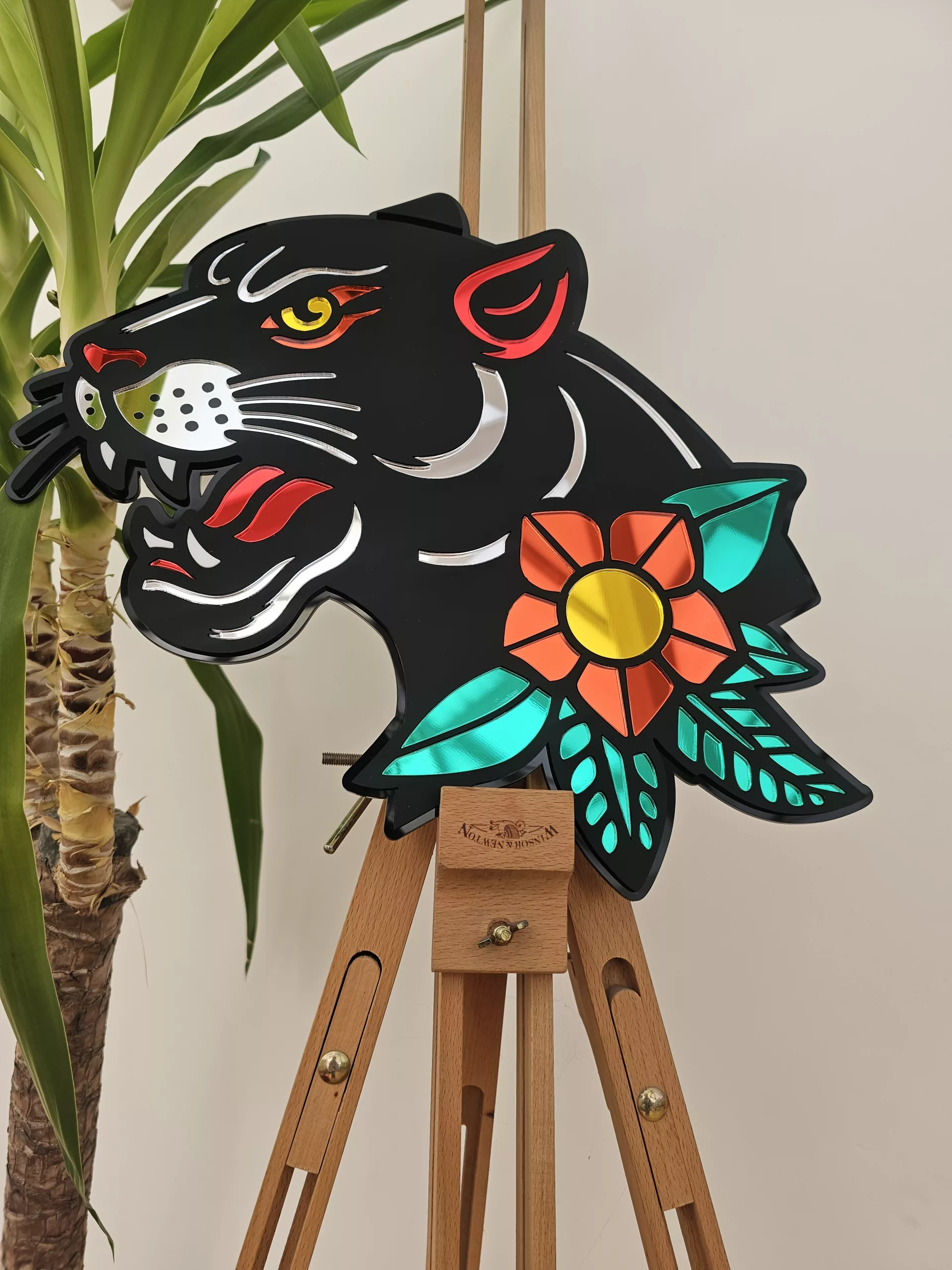 Handmade wall art in the style of an old school japanese panther tattoo. Made with matt black and mirror accents.