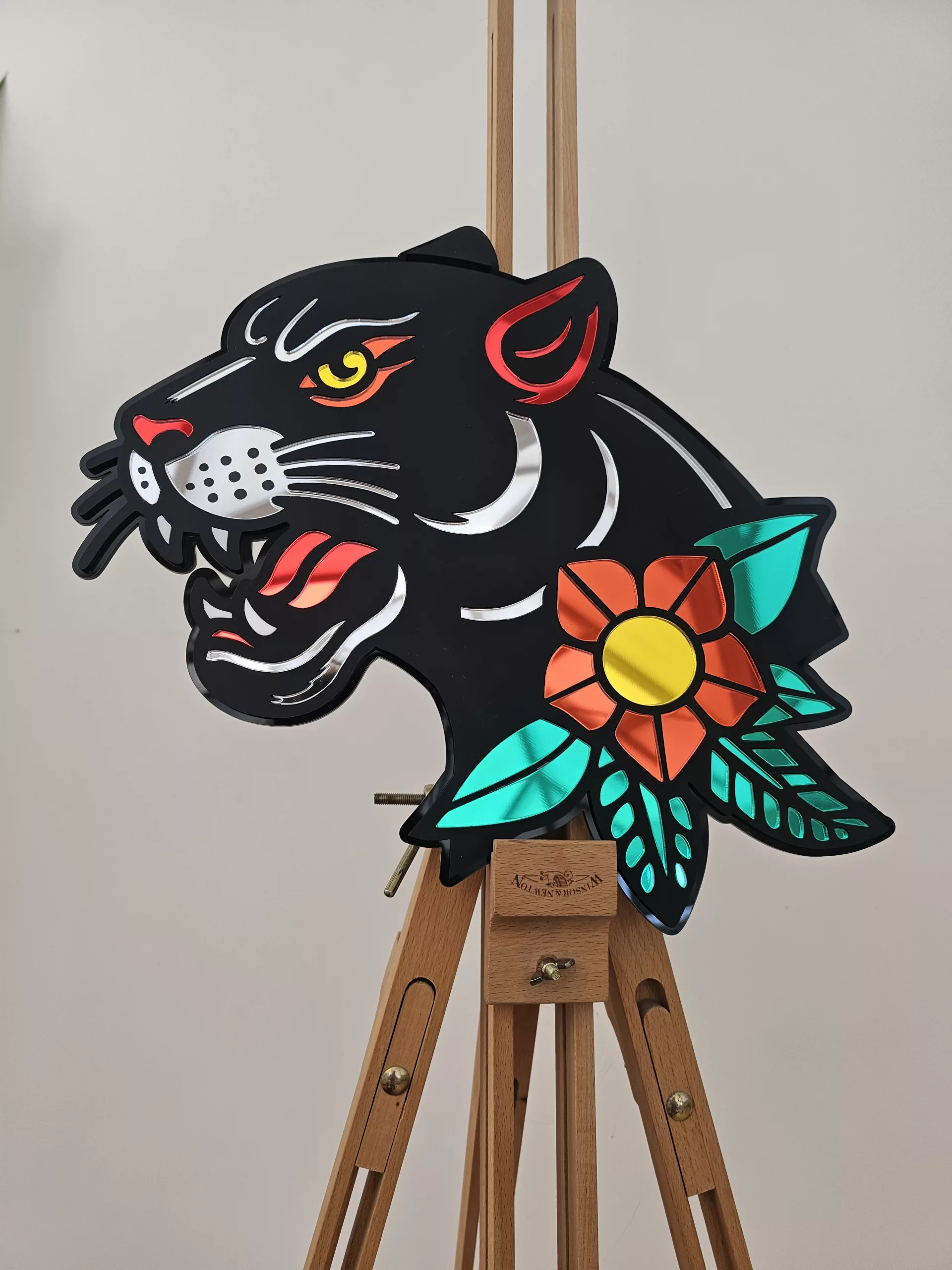Handmade wall art in the style of an old school japanese panther tattoo. Made with matt black and mirror accents.