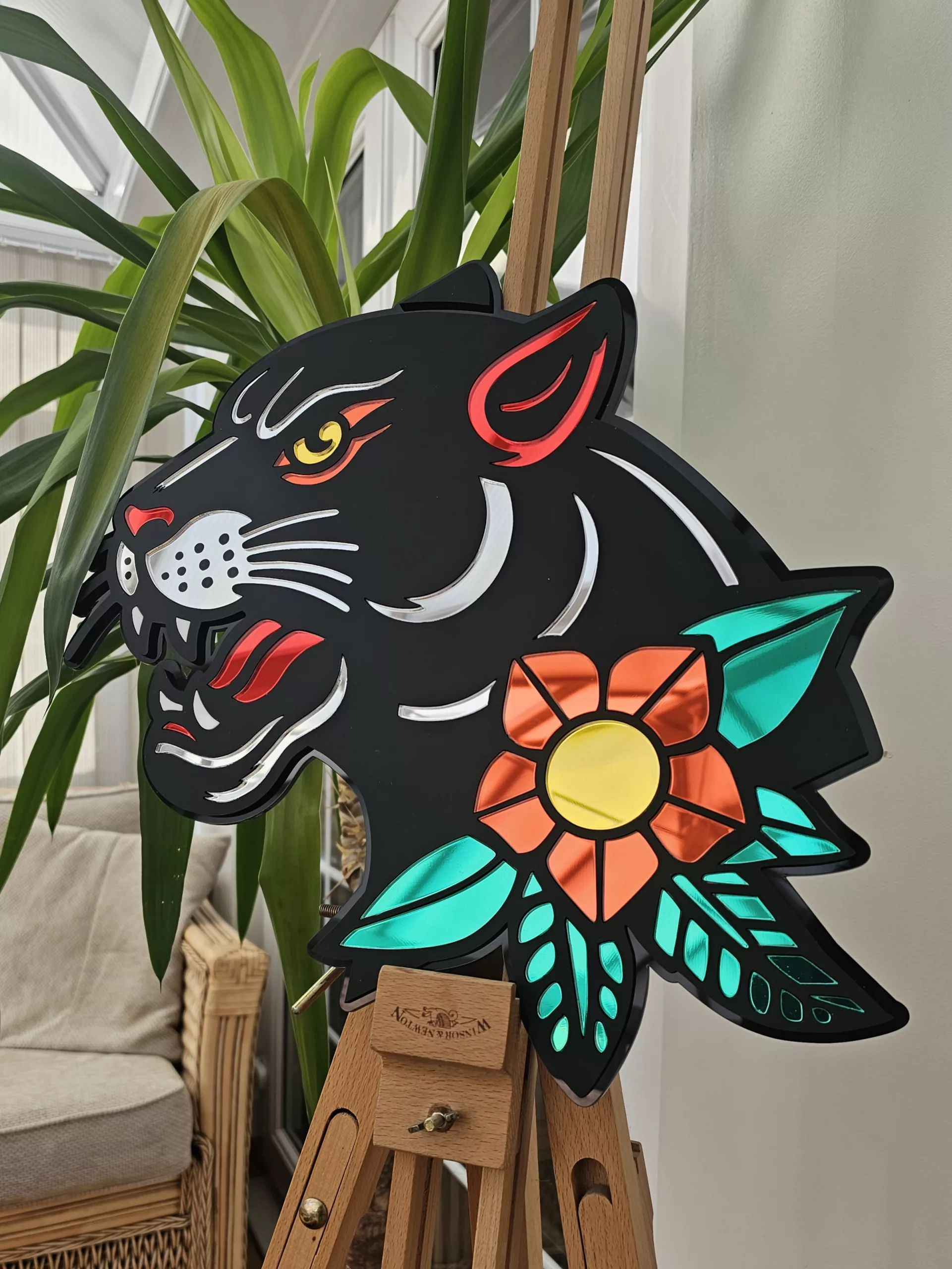 Handmade wall art in the style of an old school japanese panther tattoo. Made with matt black and mirror accents.
