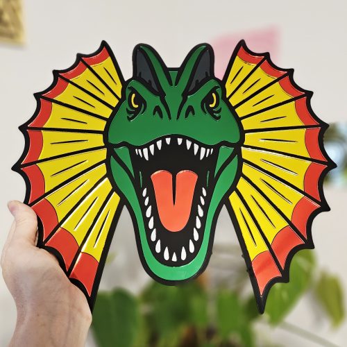 Colourful mirrored acrylic wall art in the shape of a Dilophosaurus dinosaur.