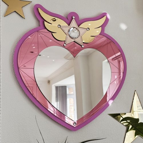 A heart mirror. Woth pink frame, layered with pink and silver heart, with details including gold wings inlaid with crystals.